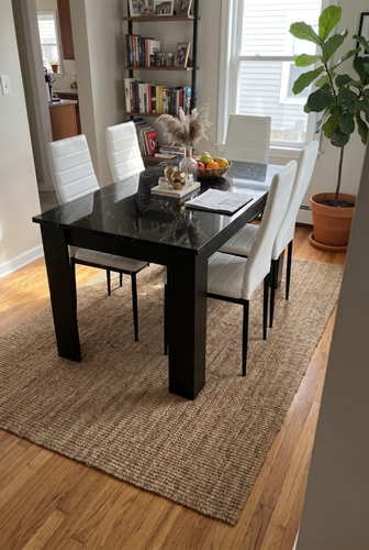 Black marble-effect dining table and 4 chairs for a modern dining corner.png