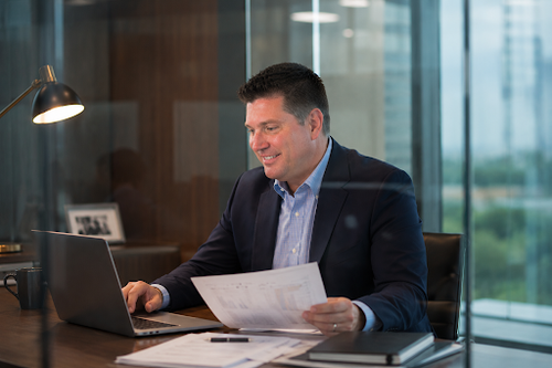 Kerry Byler Reviewing Business Strategy and Performance.png