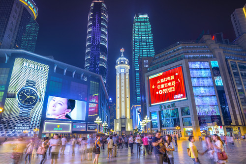 CHONGQING, CHINA - JUNE 1, 2014: People stroll through the Jiefangbei CBD pedestrian mall. The distr.jpg