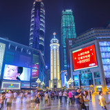 CHONGQING, CHINA - JUNE 1, 2014: People stroll through the Jiefangbei CBD pedestrian mall. The distr