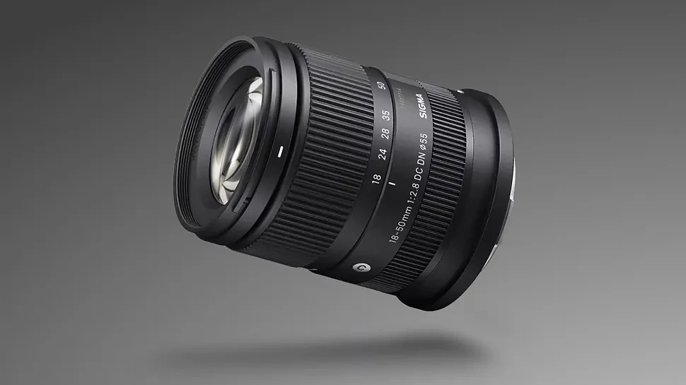 Sigma 18-50mm f/2.8 DC DN | C Canon RF lens against a grey, gradient background