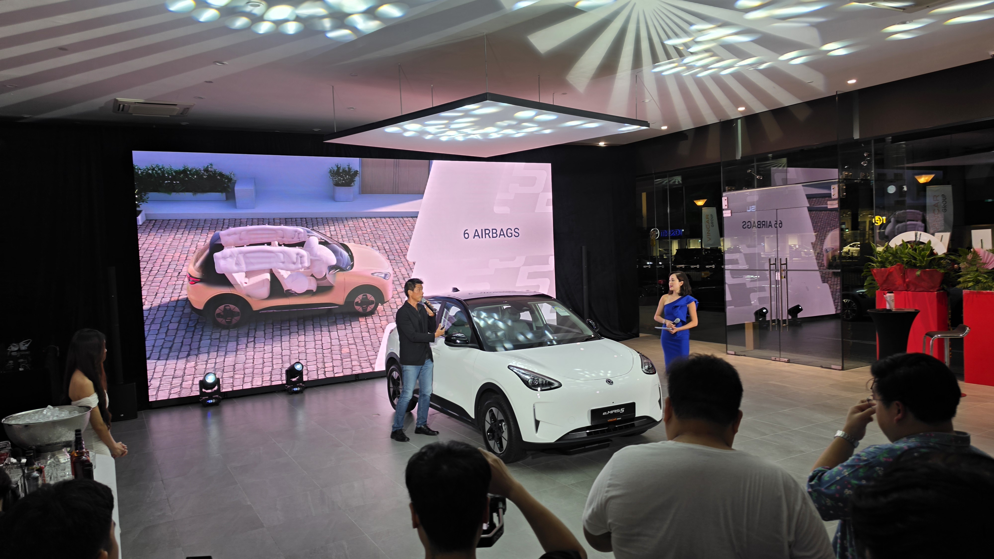 Guest speakers presenting the Proton e.MAS 5 at its Singapore launch event