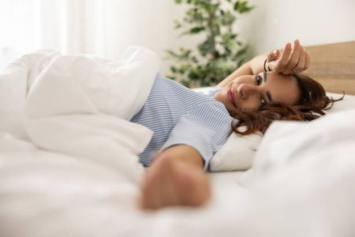 Young woman in bed after sleeping, wake up happy, healthy lifestyle, mindfulness, wellbeing, enjoy l.jpg