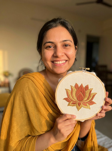 Woman holding embroidery 202604200127.jpg