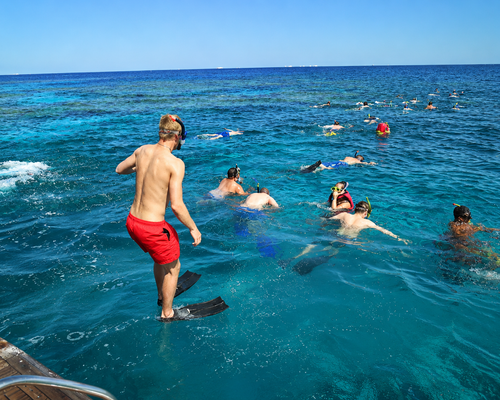 Yacht cruising in turquoise water at Sataya