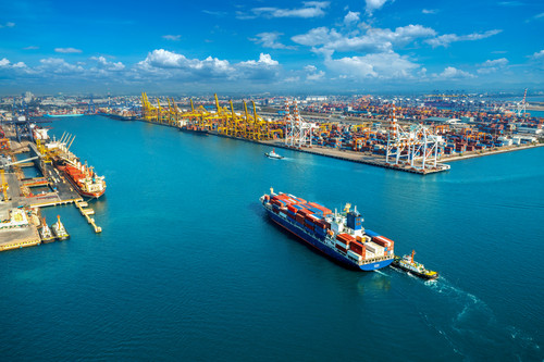 Aerial view of cargo ship and cargo container in harbor..jpg