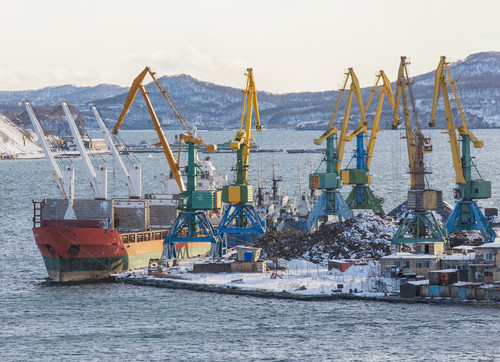 The winter seaport with ships and cranes.jpg