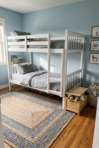 Bunk bed for kids with guardrails and ladder access.png