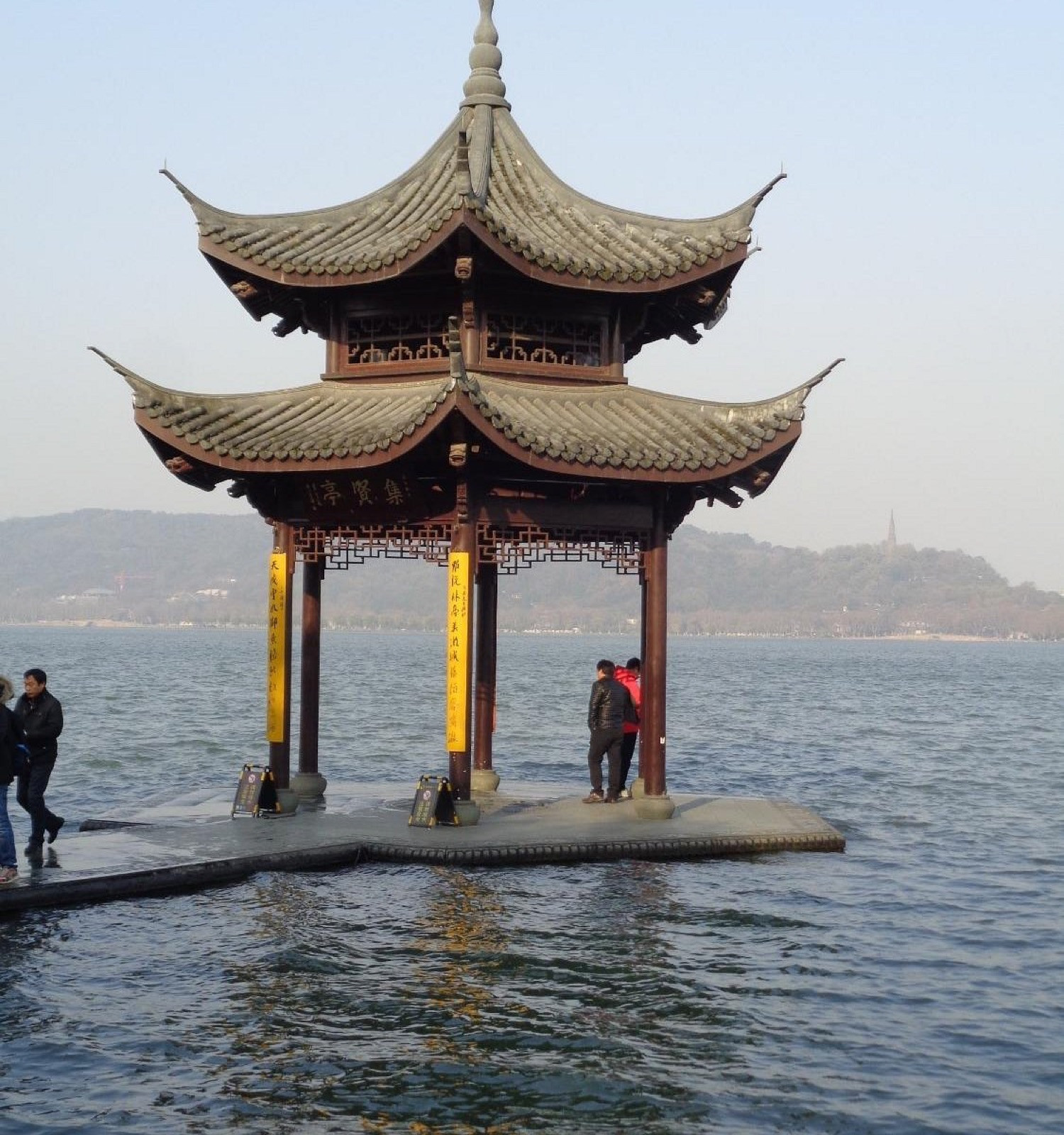 A traditional pavilion standing in the lake at Three Pools Mirroring the Moon