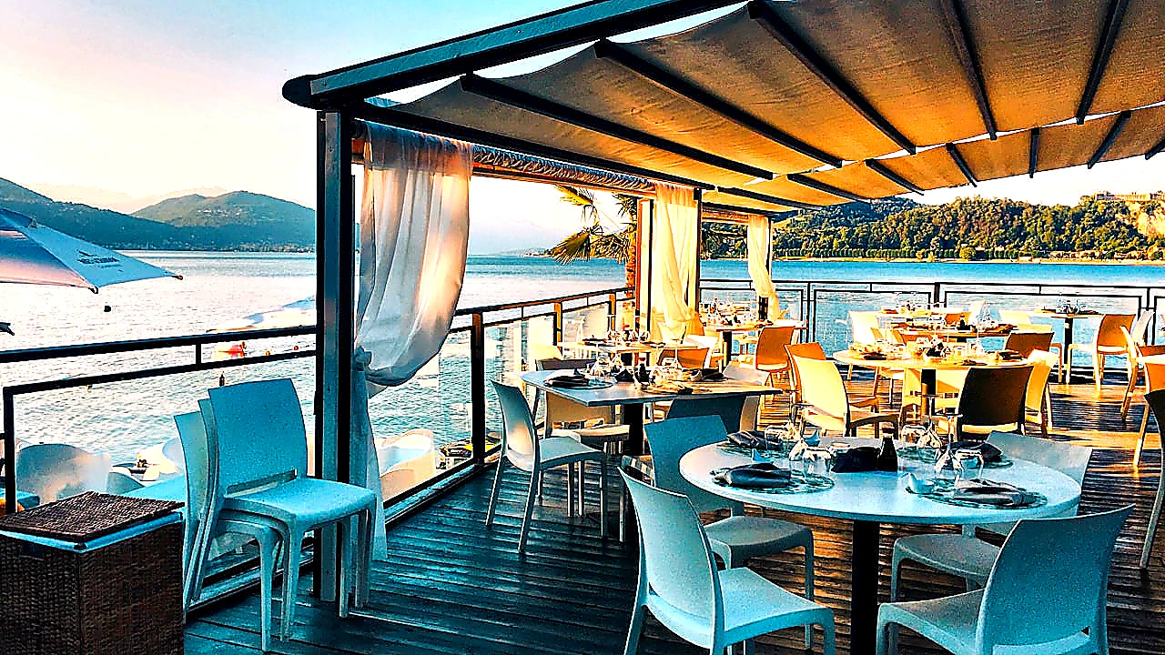 Vivid mid-article photo of chefs working under a well-lit CaptiveAire-style canopy hood