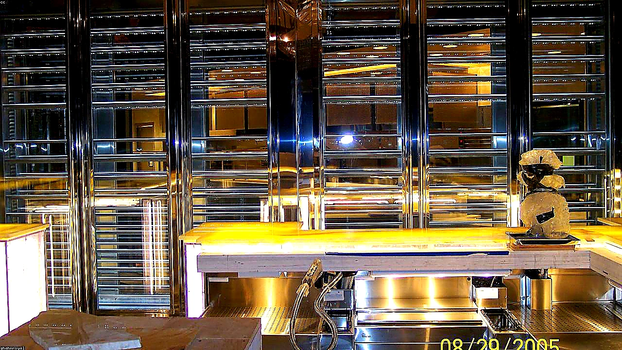 Sharp closing photo of a clean commercial kitchen with a full-length exhaust hood system