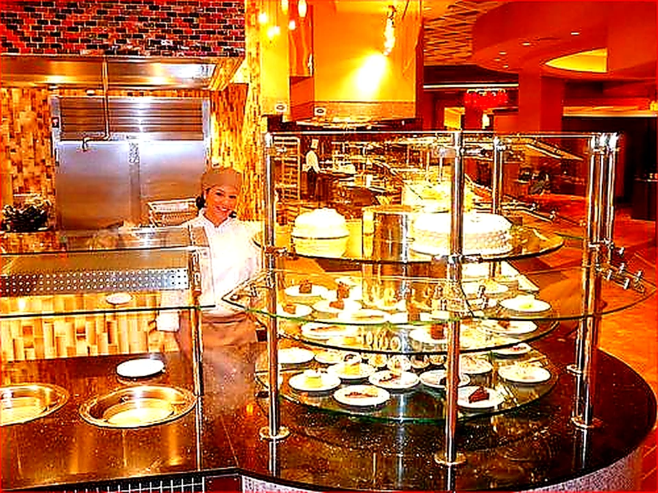 Vivid mid-article photo of chefs working under a well-lit CaptiveAire-style canopy hood