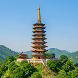 A photorealistic architectural photograph of the Medicine Buddha Ten Thousand Buddhas Pagoda, Mahabo