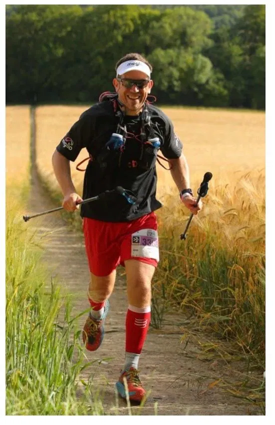 Nev running through the wheat fields with poles