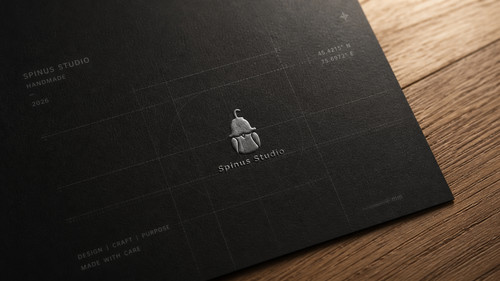 Spinus Studio Dark Logo Card on Wood.jpg