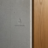 Spinus Studio Embossed Concrete Logo