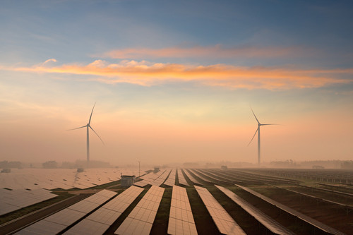 Solar panels and windmills in the power plant.jpg