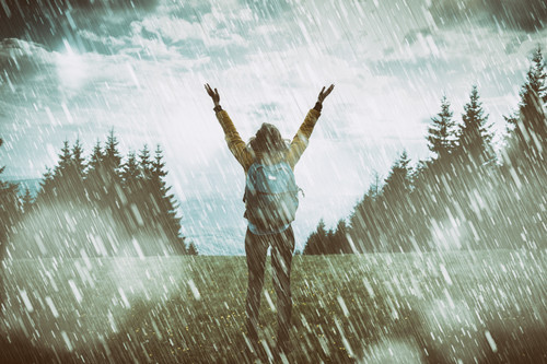 Girl praying for good weather on a rainy day..jpg