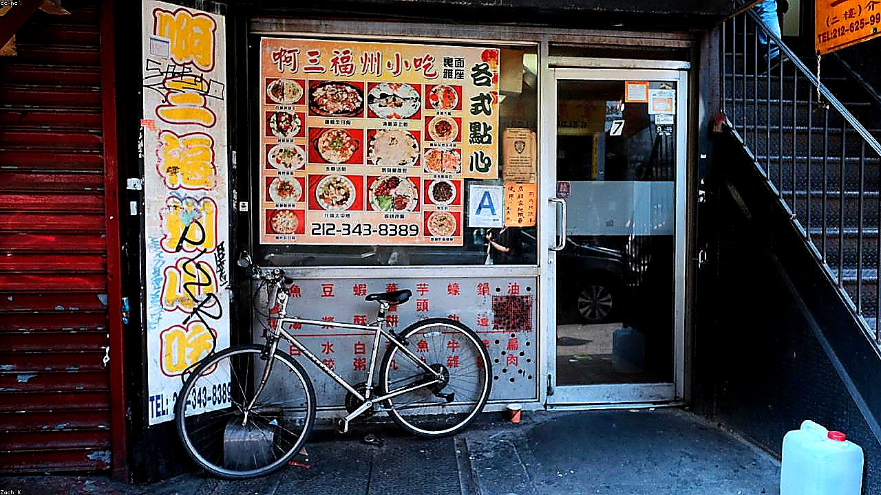 Vivid mid-article photo of restaurant operators studying colorful trade-area maps and analytics dashboards in a bright planning studio