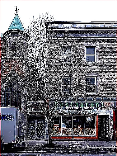 Sharp closing photo of a successful restaurant storefront with vivid exterior lighting and a planning workspace visible through open glass doors