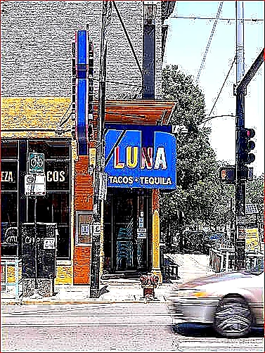 Sharp closing photo of a successful restaurant storefront with vivid signage and warm evening light on a lively street