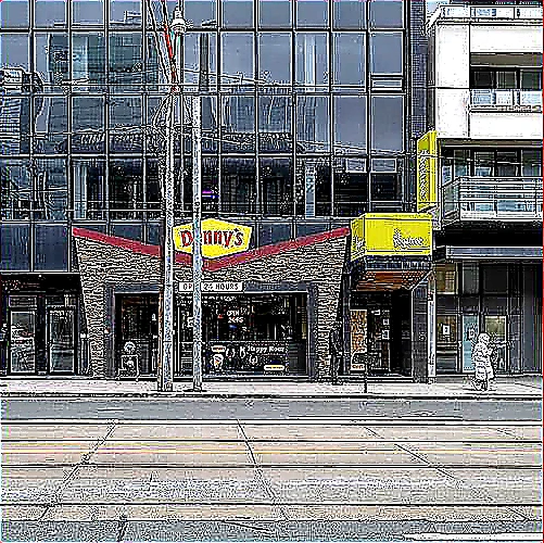 Sharp closing photo of a successful restaurant storefront with bold signage and warm evening lights on a busy avenue