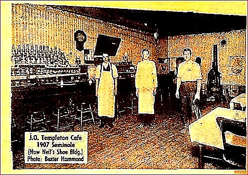 Bright colorful hero photo of a sunlit restaurant dining room with vibrant chairs and operators reviewing lease documents at a front table