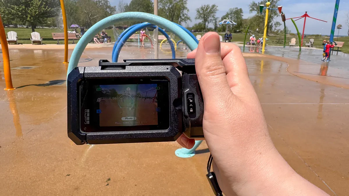 The GoPro Mission 1 Pro with the point-and-shoot grip at a splash park