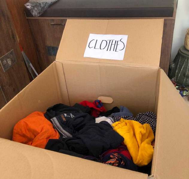 Carton filled with donated clothes