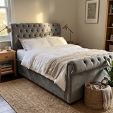 Dark grey ottoman double bed with Chesterfield rolled headboard
