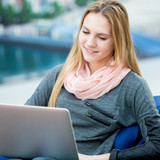 smiling girl with a laptop 1163 465