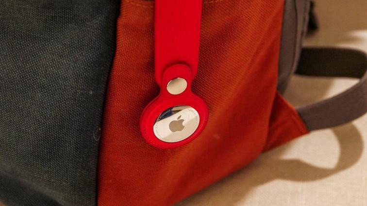 None A bag with an apple AirTag in a red holder