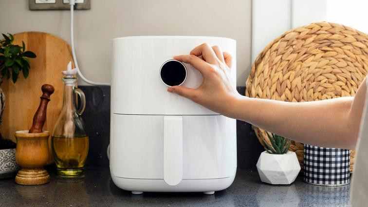 None air fryer on counter being turned on