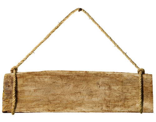 wooden sign hanging from rusty nail.jpg