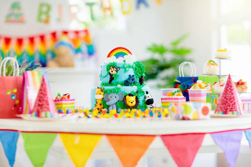Cake for kids birthday celebration. Jungle animals theme children party. Decorated room for boy or g.jpg