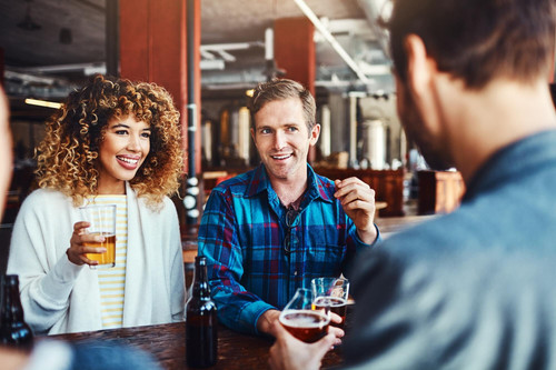 bar couple conversation with beer fun talking celebration raise job with friends club woman man part.jpg