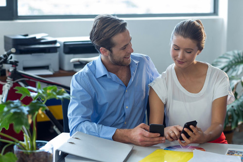 male female graphic designers using mobile phone 107420 78888.jpg