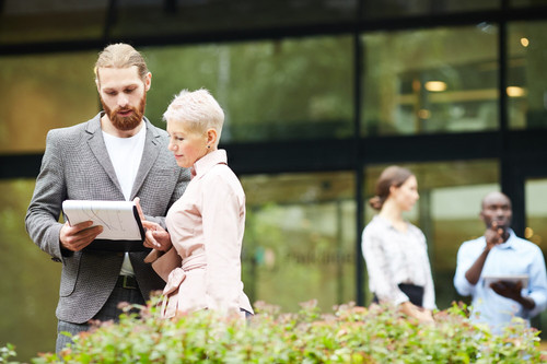 successful business people discussing work outdoors 236854 13099.jpg