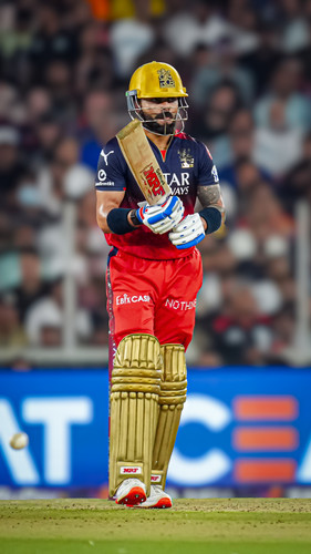 Ahmedabad: Royal Challengers Bengaluru's batter Virat Kohli and Punjab Kings' bowler Yuzvendra Chaha.jpg