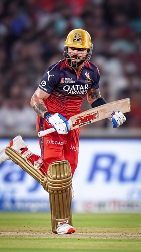 Ahmedabad: Royal Challengers Bengalurus Virat Kohli and Mayank Agarwal run between the wickets durin.jpg