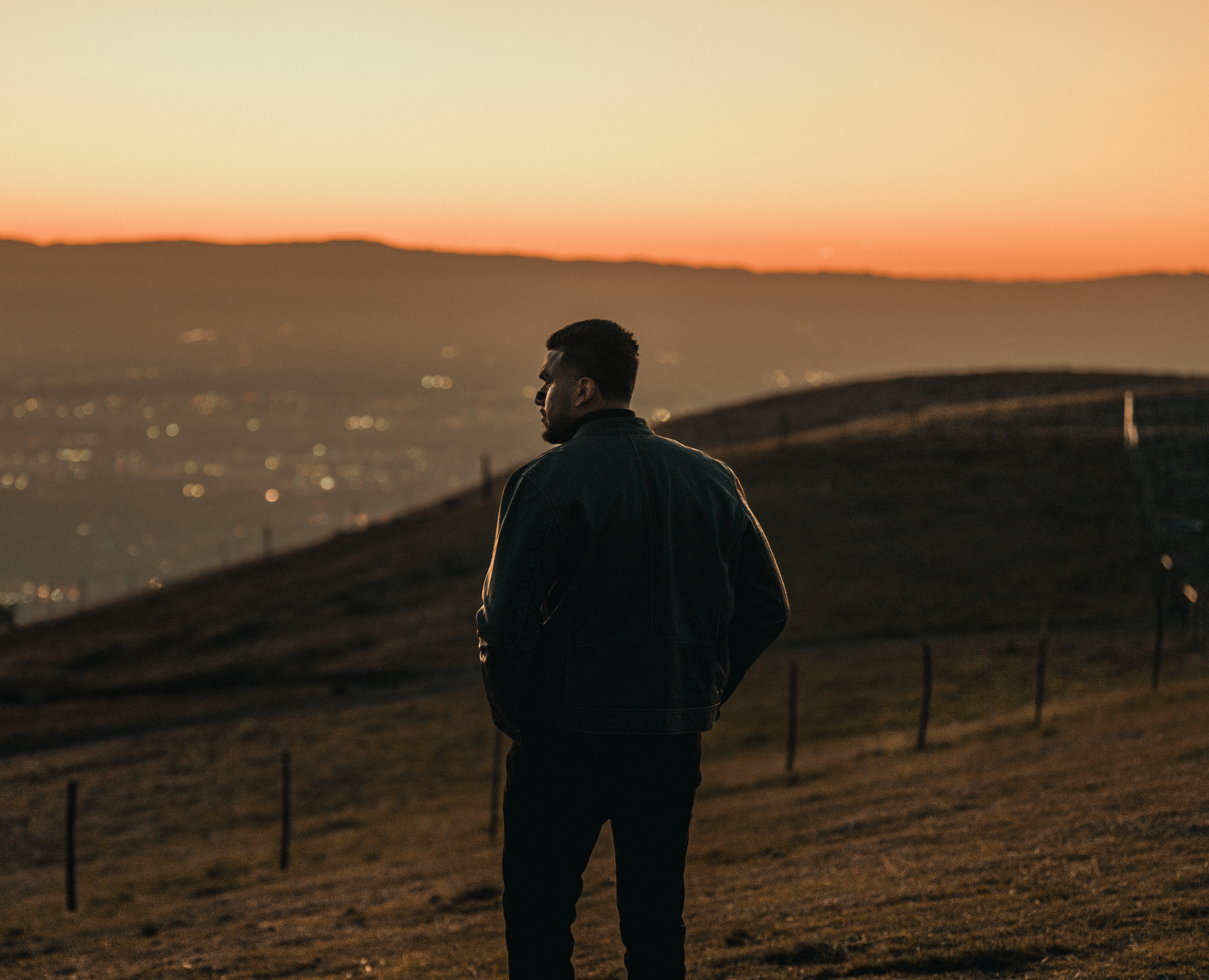 Hero background image of a man looking over a city