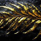 there is a gold leaf on a black background