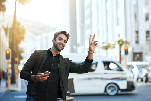 man mobile wave city taxi online transport service friendly morning commute person happy phone stree.jpg
