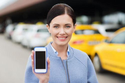 travel business trip people tourism concept smiling young woman showing smartphone blank screen taxi.jpg