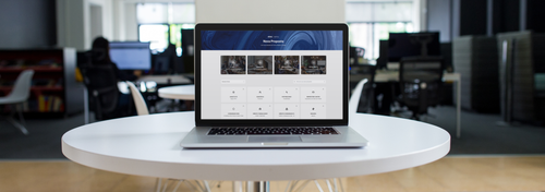 macbook pro mockup on a white table in a modern office a12366.png