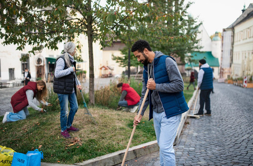 young man volunteer with team cleaning up street community service concept 1221914 10208.jpg