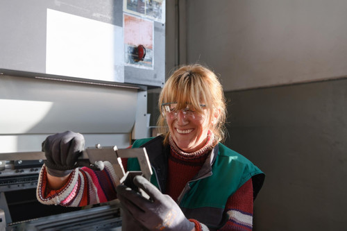 woman working modern factory production processing metals preparing measures materials that go proce.jpg