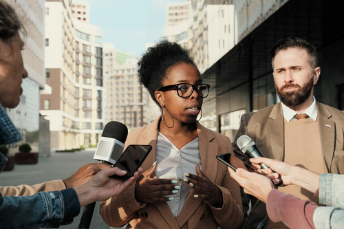 business people speaking microphones they giving interview journalists city outdoors 249974 5655.jpg