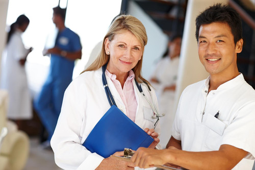 caring health professionals shot two medical professionals smiling camera 590464 31571.jpg