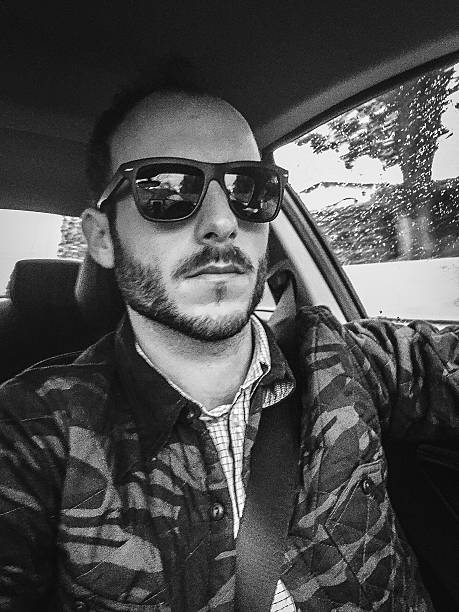 man on the car selfie.jpg